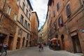 SIENA, ITALY Ã¢â¬â MAY 25, 2017: Medieval narrow street in Siena, Tuscany, Italy.